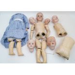 A doll restorer’s lot of various ball jointed doll’s bodies, bisque dolls heads (A/F) and an