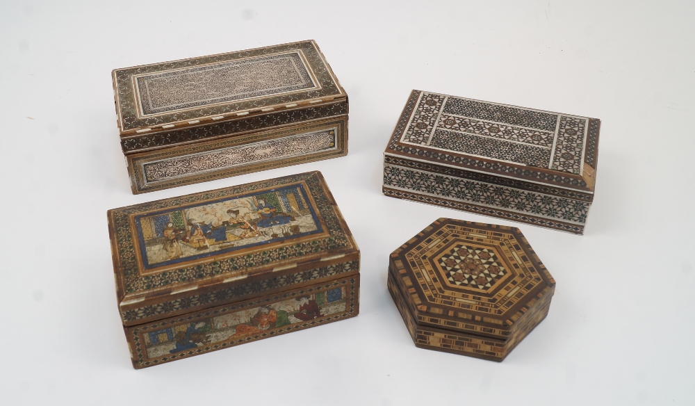 Four Persian Khatam boxes, to include: one with white metal panels with scrolling foliate decoration