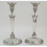 A pair of Edwardian silver candlesticks, Chester, 1913, Barker Brothers (Herbert Edward Barker &