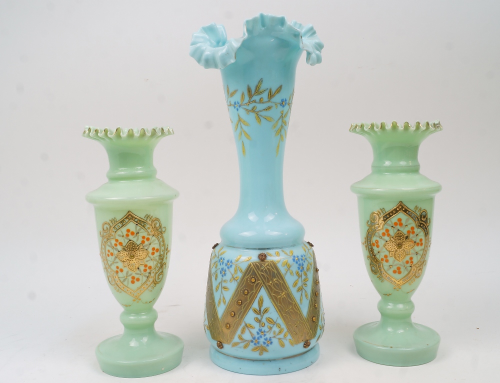 A pair of Continental green opaline glass vases, second half 20th century, with wavy rims, the