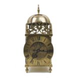 A brass cased lantern style mantel clock, early 20th century, the brass case surmounted by pierced