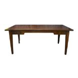 An early 20th century French farmhouse mahogany dining table, the plank top above two drawers,