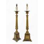 A pair of Regency style gilt-metal table lamps, late 19th century, later converted to electricity,
