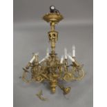 A Victorian style brass twelve branch chandelier, 100cm high It is the buyer's responsibility to