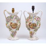 A pair of Continental floral encrusted twin handled vases, 20th century, each with a central painted