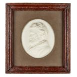 Attributed to Sir Joseph Boehm, Austrian, 1834-1890, a Victorian wax portrait relief of Thomas