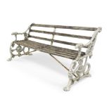 A late Victorian cast aluminium garden bench, the frame painted white with dog head arm rests,