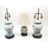 A pair of modern Chinese vase table lamps, each with domed cover, the bodies decorated with birds on