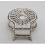 A silver inkstand, London, 1904, Blackburn & Tysall, formed as a scallop shell, the shell hinged lid