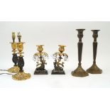 A pair of gilt and patinated bronze candlesticks, late 19th/early 20th century, with leaf form