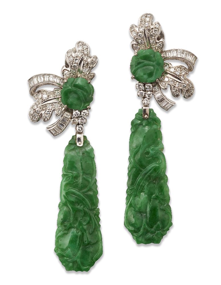 A pair of Jadeite jade and diamond pendant earrings, each designed as a claw-set carved circular