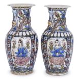 A pair of large Qajar moulded pottery vases, Iran, late 19th century, of baluster form, underglaze
