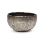 A Sasanian silver bowl, 6th-7th century A.D., with later added engraved decoration, of deep form and
