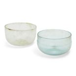 Two Roman glass hemispherical bowls, one cracked, Circa 4th Century A.D. Thin-walled with pronounced