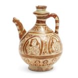 A lustre-painted pottery ewer, Persia, 12th century, on a short foot with rounded body, curved spout