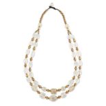 A double strand carved rock crystal bead necklace, composed of faceted ovoid shape beads, vase-shape