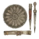 An Ottoman silver filigree circular mirror, a dagger, and a silvered filigree belt, Turkey, late