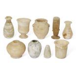 A group of Antiquities comprising four small Egyptian alabaster vessels Middle Kingdom-Ptolemaic