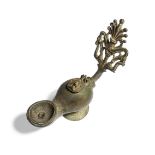 A Roman-style bronze oil lamp with elaborate open work handle of a palmette with dolphins, the lid