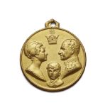 A gilt metal medal commemorating the coronation of Muhammad Reza Shah and Queen Farah medal