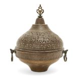 A domed lidded copper openwork brazier, Iran, 19th century, with openwork finial and handle either