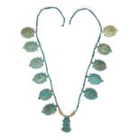 An Egyptian blue glazed faience lotus flower necklace Amarna Period, mid-14th Century B.C.
