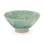 An incised ware turquoise glaze pottery bowl, Gurgan, Persia, 12th century, of conical form, incised