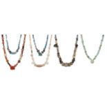Seven strings of hardstone, glass, calcite and glazed faience beads Circa 1st Millennium B.C. –