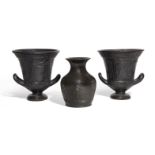 Three decorative black glazed vessels, including two kraters, with moulded decoration, 16.9cm.