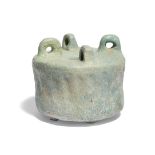 A Kashan turquoise glazed pottery inkwell, 12th century, Iran, of cylindrical form, with circular