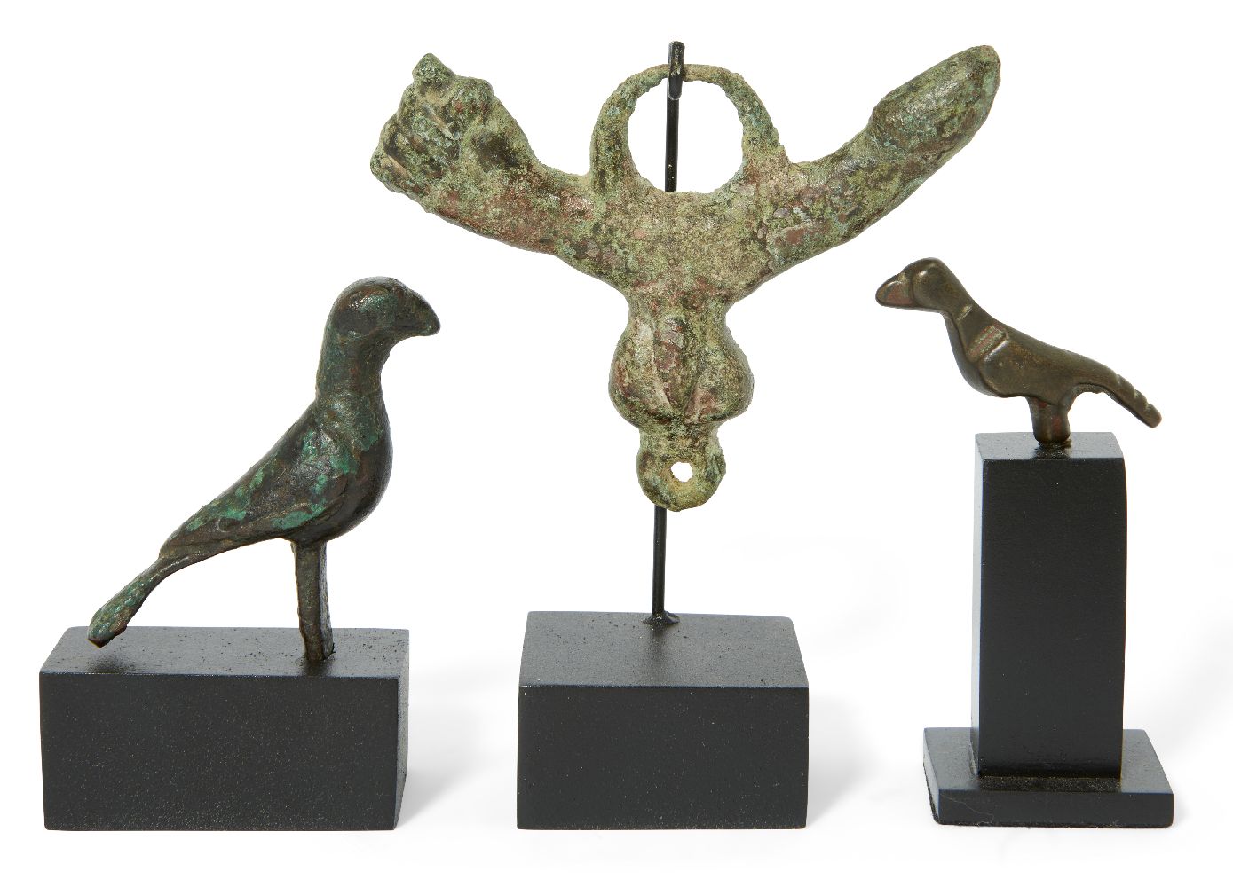 A Roman bronze phallic amulet, 1st-2nd Century A.D., and two Byzantine bronze birds, with central