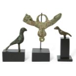 A Roman bronze phallic amulet, 1st-2nd Century A.D., and two Byzantine bronze birds, with central