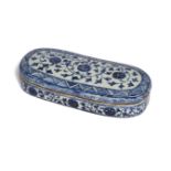 A blue and white pottery scribes box, Persia, 17th century, of oblong form with rounded ends and