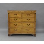 A George III mahogany chest of drawers, the frieze with marquetry inlaid butterfly and two shells,