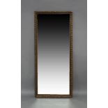 A giltwood mirror, 20th century, with moulded border and bevelled glass plate, 140cm x 60cmpiece