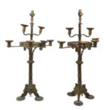 A pair of gilt-bronze seven-light candelabra, late 19th / early 20th century, in the Gothic style,