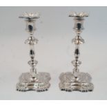 A pair of silver candlesticks, Sheffield, 1961, James Dixon & Sons, designed with knopped stems to