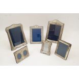 A collection of six of silver picture frames, to include: an example with foliate motifs, Sheffield,