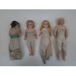 An unusual black character composition headed doll, in original handmade clothes, together with a