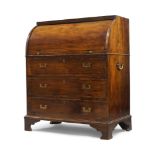 A Regency mahogany campaign cylinder bureau, early 19th century, the cylinder top enclosing
