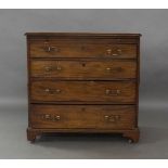 A George III mahogany bachelors chest of drawers, with brushing slide above four graduating drawers,