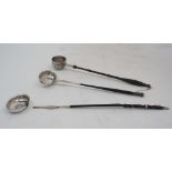 Three toddy/punch ladles, comprising; one with twisted baleen handle, the white metal bowl with 1787
