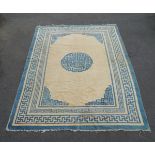 A Chinese rug with blue pole medallion in ivory field, together with three further Chinese rugs (