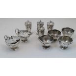 A group of silver cruets, Birmingham, 1919, Edward Souter Barnsley, comprising: four pedestal salts,