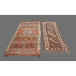 A Caucasian long rug, a Caucasian kilim, a Turkish prayer rug, and a Caucasian three panel rug (4)