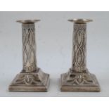 A pair of Edwardian Adam Revival silver candlesticks, London, 1901, Thomas Bradbury & Sons, of