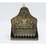 A brass Hanukkah Menorah, the shaped stand with Star of David and eight oil reservoirs, 30cm