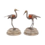 A pair of white metal and hardstone models of storks, both stamped 925, each bird raised on a