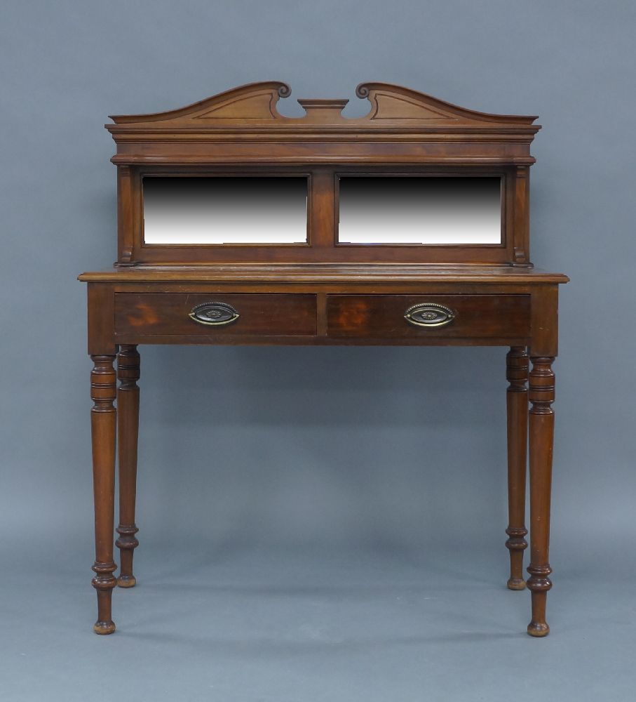 A Regency style mahogany side table, early 20th century, the mirrored back superstructure with
