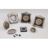 A small group of silver comprising: a pair of Edwardian silver mounted picture frames, Birmingham,